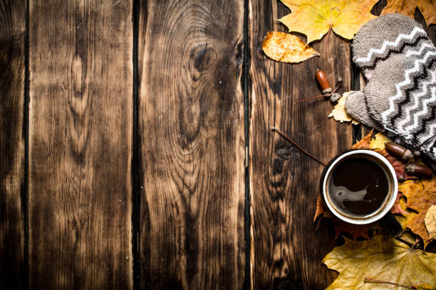 istock Autumn style. A Cup of hot coffee with mittens. 836997710