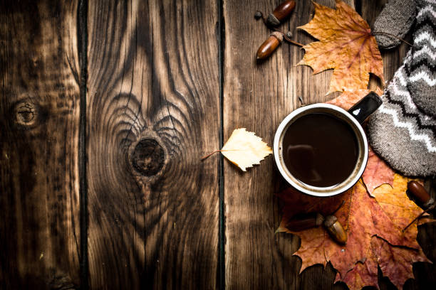 istock Autumn style. A Cup of hot coffee with mittens. 836997780