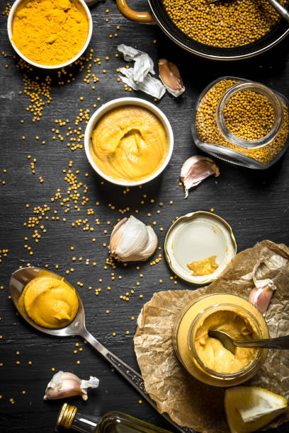 Ingredients for making mustard. Ingredients for making mustard. On a black chalkboard. mustard fruits stock pictures, royalty-free photos & images