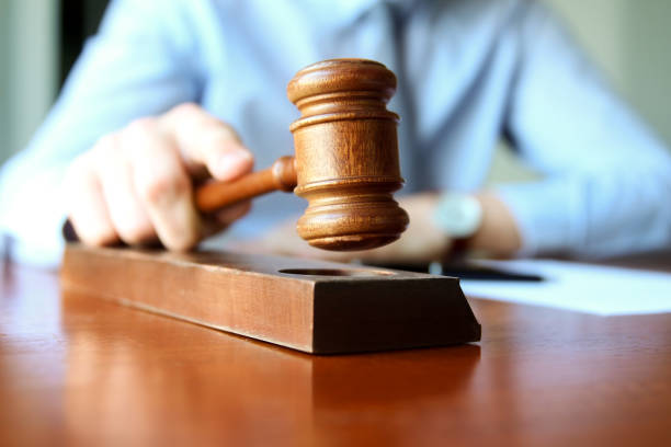 istock Judge holding gavel in courtroom 837009428
