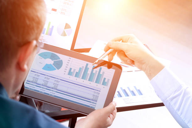 istock Business colleagues working together and analyzing financial figures on a digital tablet. 837009584