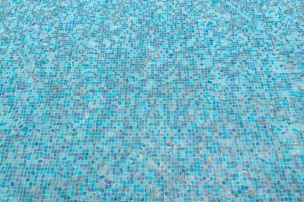 istock blue swimming pool with sunny reflections abstract for background 837017704