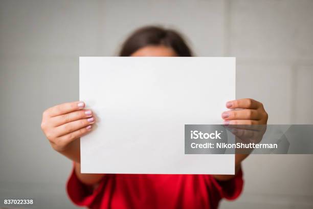 Girl With Blank Paper Stock Photo - Download Image Now - Holding, Paper, Child