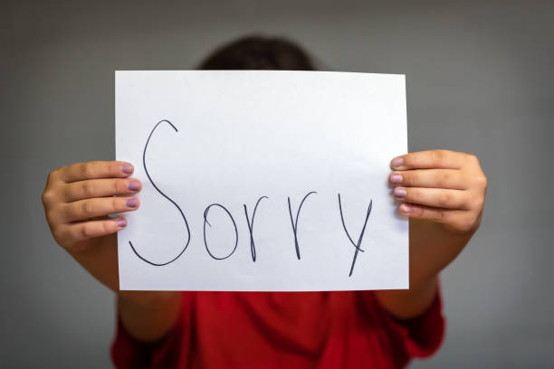 istock Girl Holding Up Sorry 837022374