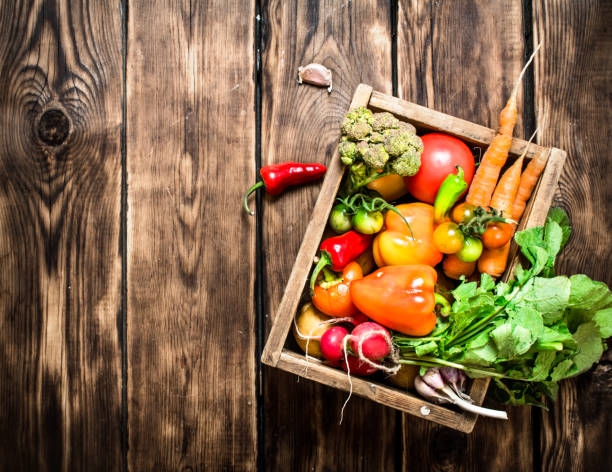 istock Healthy food. Organic vegetables in an old box. 837028076