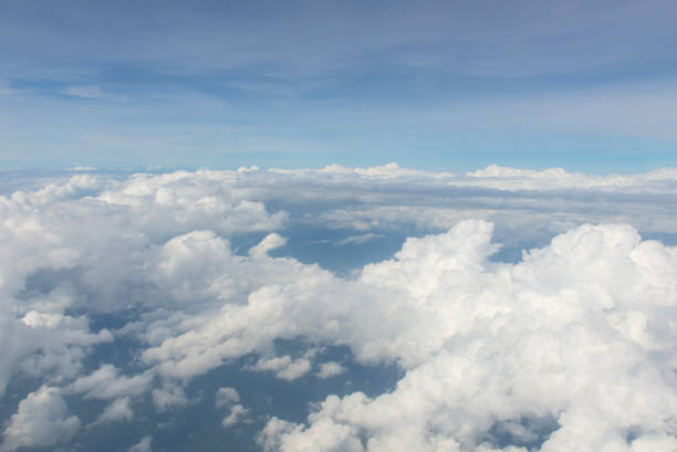 istock Blue sky and Clouds as seen through window of aircraft 837028082