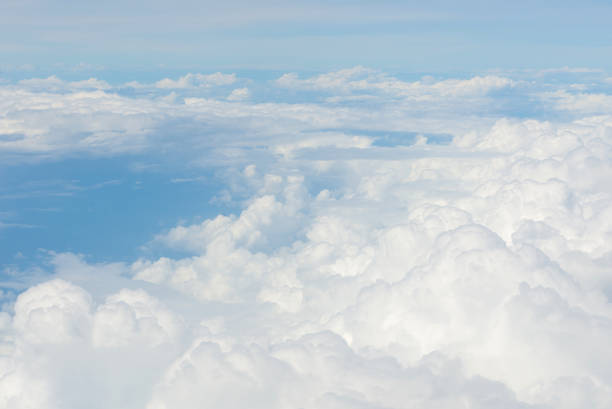 istock Blue sky and Clouds as seen through window of aircraft 837028364