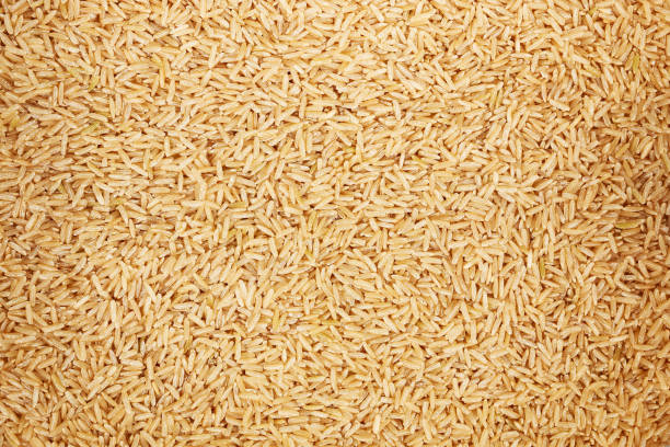 istock healthy unpolished brown rice for pattern and background 837030512