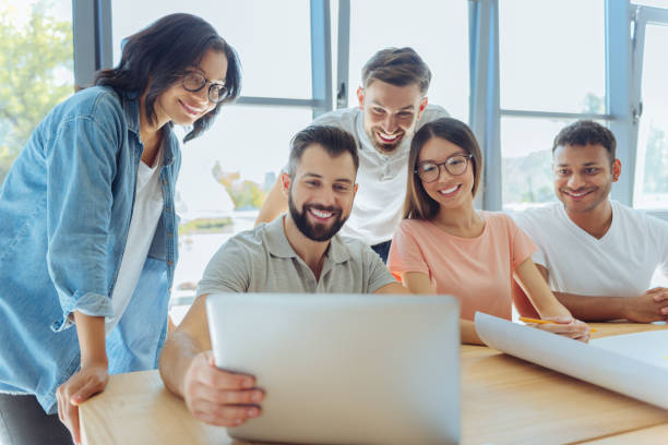 istock Happy positive people looking at the laptop screen 837035170