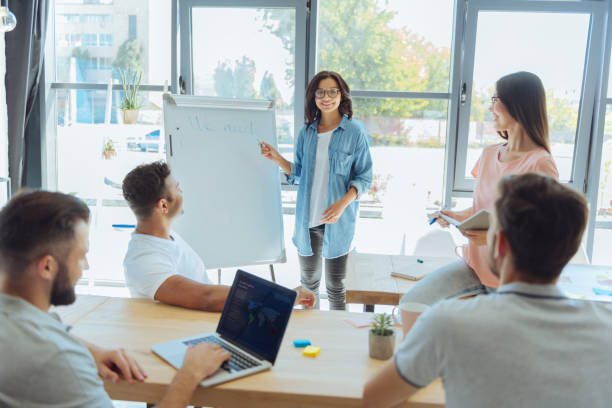 istock Nice smart woman pointing at the whiteboard 837036656