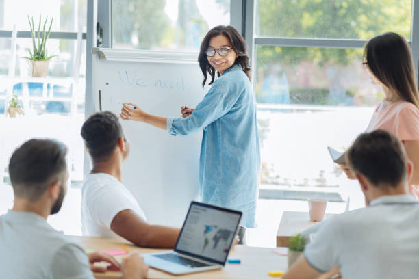 istock Positive delighted woman writing on the whiteboard 837037430
