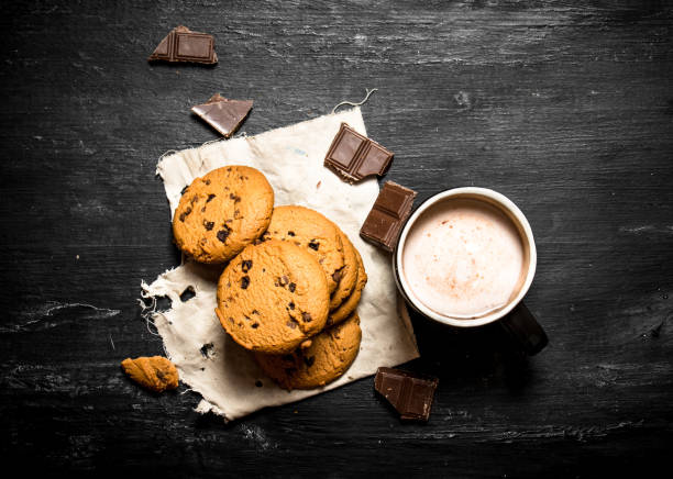 istock Oat biscuits with pieces of chocolate and drink cocoa. 837037698