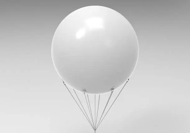 Photo of Blank white promotional outdoor advertising sky giant inflatable PVC helium balloon flying in sky for mock up and template design.