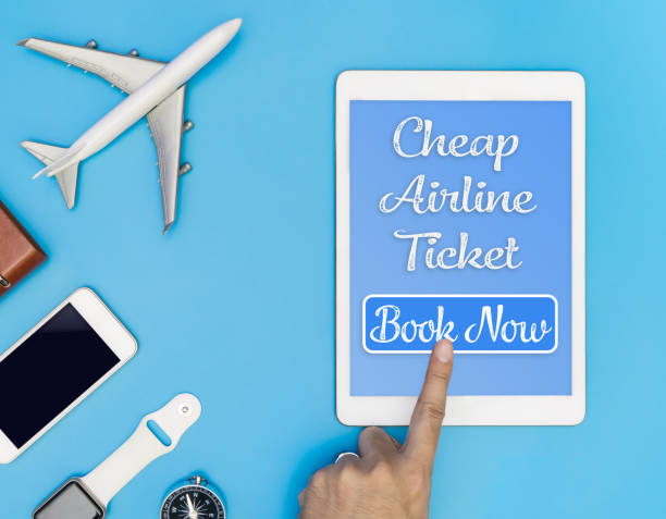 istock Travel Cheap Airline ticket click button on tablet 837060446
