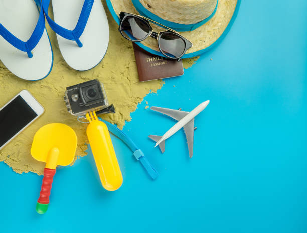 istock Beach Summer Vacation gadgets and fashion on blue copy space 837060898