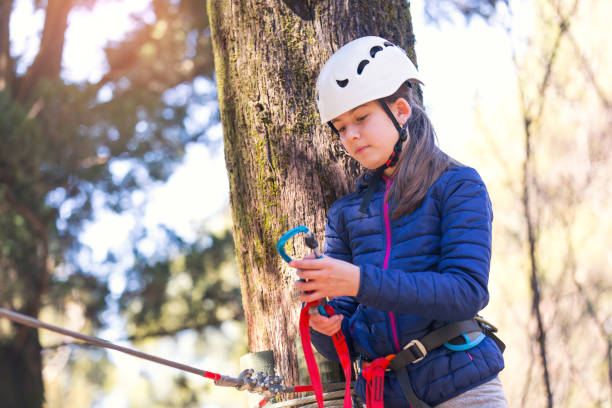 istock Girl enjoying activity in a climbing adventure park 837081148