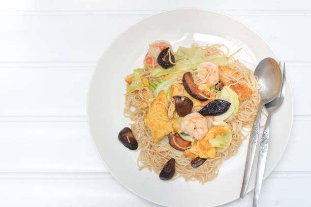 istock Home cooked stir fried noodle on white plate 837092088