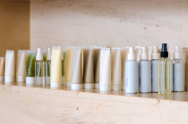 Group of variable skin care container products from natural ingredients on  marble shelf