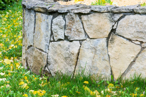 istock Texture, pattern, background. Autumn leaves, Granite stones. Sandstone, put a fence flowerbeds. sedimentary rock consisting of sand or quartz grains cemented together, typically red, yellow, or brown in color. 837114316
