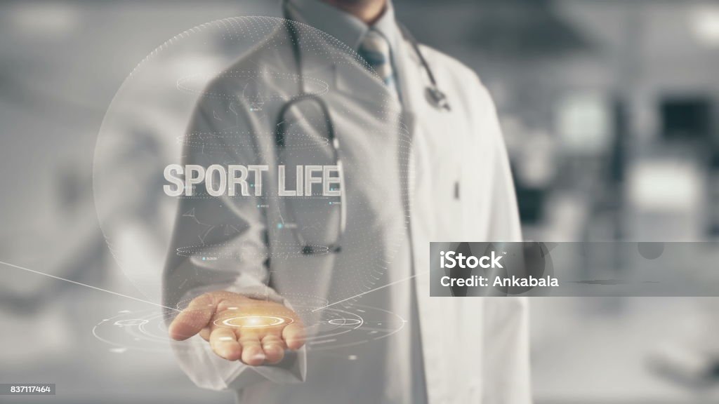 Doctor holding in hand Sport Life Concept of application new technology in future medicine Active Lifestyle Stock Photo