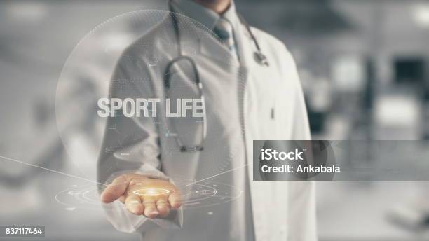 Doctor Holding In Hand Sport Life Stock Photo - Download Image Now - Active Lifestyle, Athlete, Backgrounds