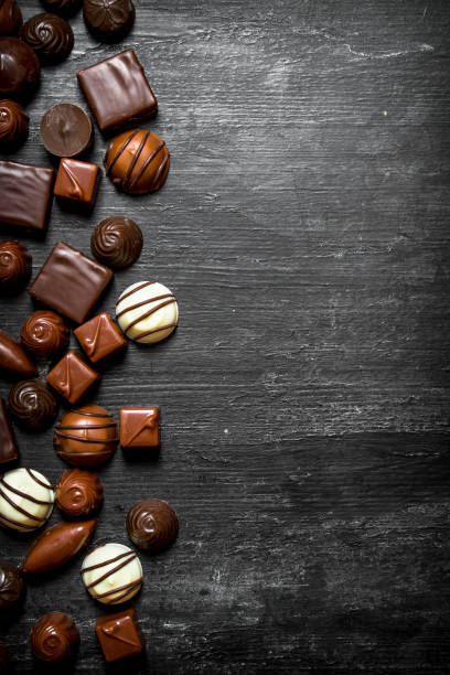 istock Chocolates. On wooden background. 837122630