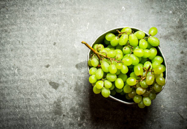 istock White grapes in the old pot. 837156118