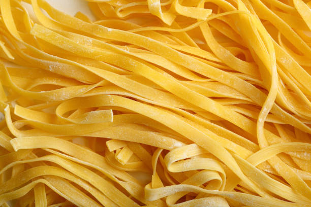 istock Raw italian pasta tagliatelle closeup 837158194
