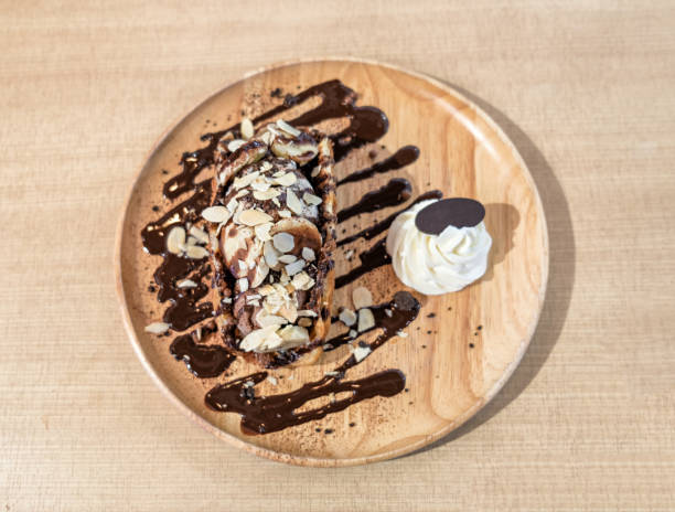 istock Nutella Puff Parfait banana with chocolate on tray 837165220