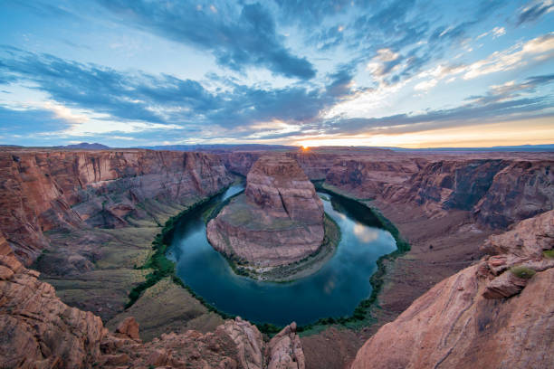 Sunset Horseshoe Bend Colorado River Arizona Sunset at Horseshoe Bend. Scenic view over Arizona Horseshoe Bend - Horseshoe Canyon at dusk with Colorado River in Glen Canyon. Ultra-ultra-wide angle 10mm non-fisheye panorama shot. Page, Arizona, USA. horseshoe canyon stock pictures, royalty-free photos & images