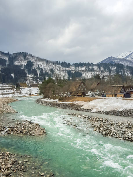 istock Village antique emerald river on winter season 837167892