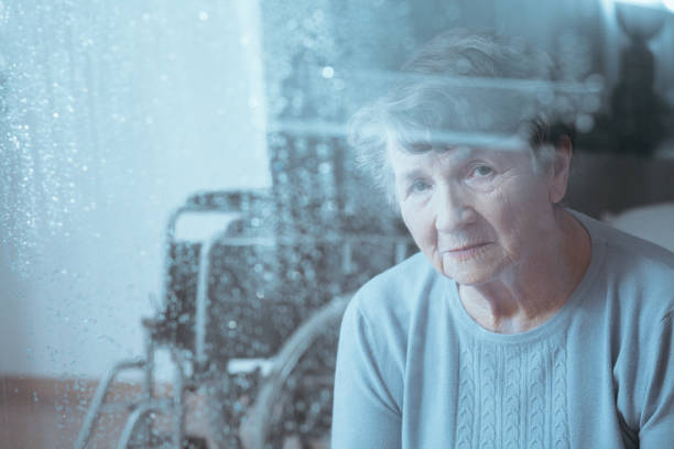 Sad, senior disabled woman
