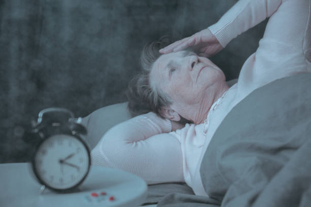 Senior woman having sleep disorder Senior woman having sleep disorder, lying in bed sleeping pill stock pictures, royalty-free photos & images