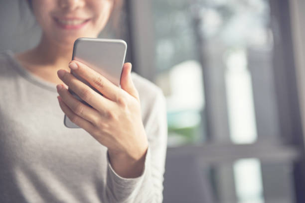 istock Happy woman using smartphone and copy space 837173858