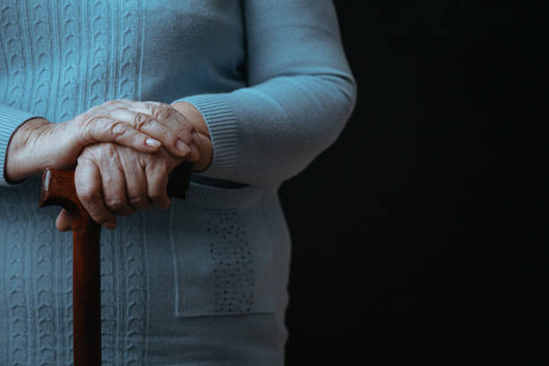istock Old person with walking stick 837175110