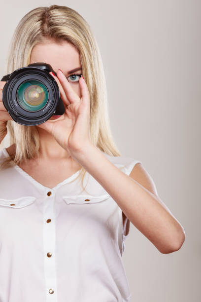istock Beautiful woman with camera. 837179498