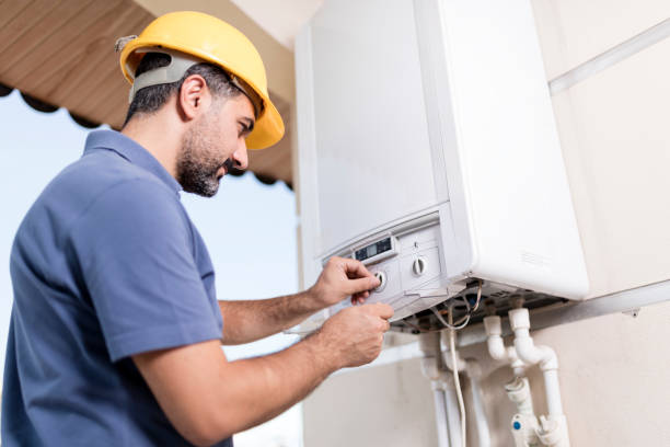 Natural Gas Combi Service Boiler technician working in home. heating repair service stock pictures, royalty-free photos & images