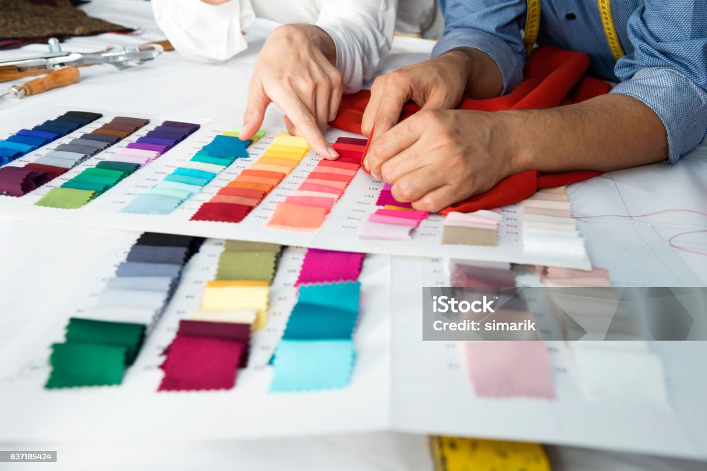 Fashion Designers Fashion designers are choosing fabric and color for their new collection. Textile Stock Photo