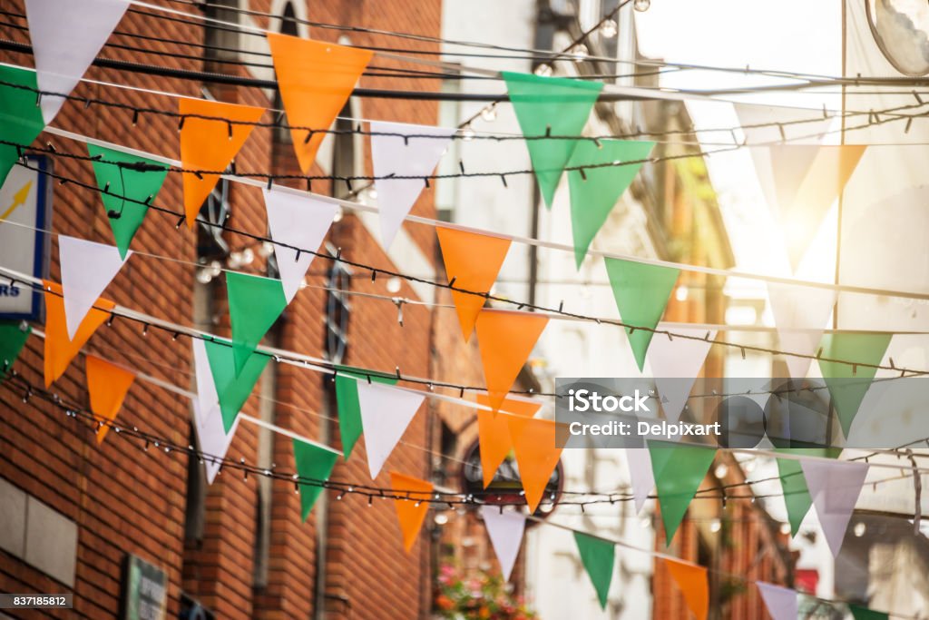 Garland with irish flag colors in a street of Dublin, Ireland - Saint Patrick day celebration concept St. Patrick's Day Stock Photo