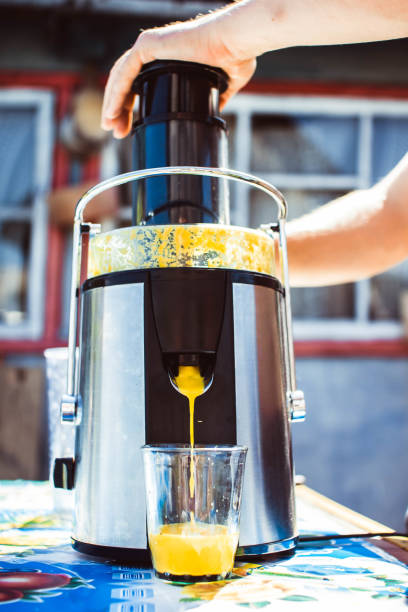 istock Preparation of juice from an orange 837187118