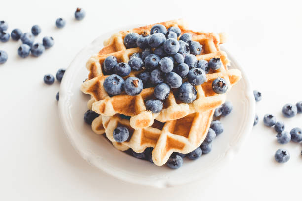 istock plate of tasty belgian waffles with blueberries 837192902