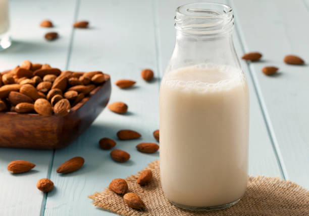istock Almond Milk and nuts in a wooden bowl 837194310