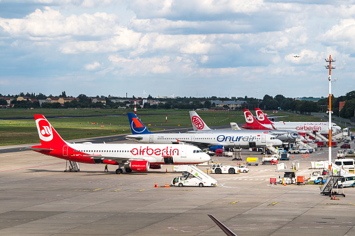 Berlin, Germany - August 19, 2017: Airplanes from Air Berlin being in parking position to take cargo and passengers at the Tegel 'Otto Lilienthal' Airport (TXL), situated to the north of Berlin