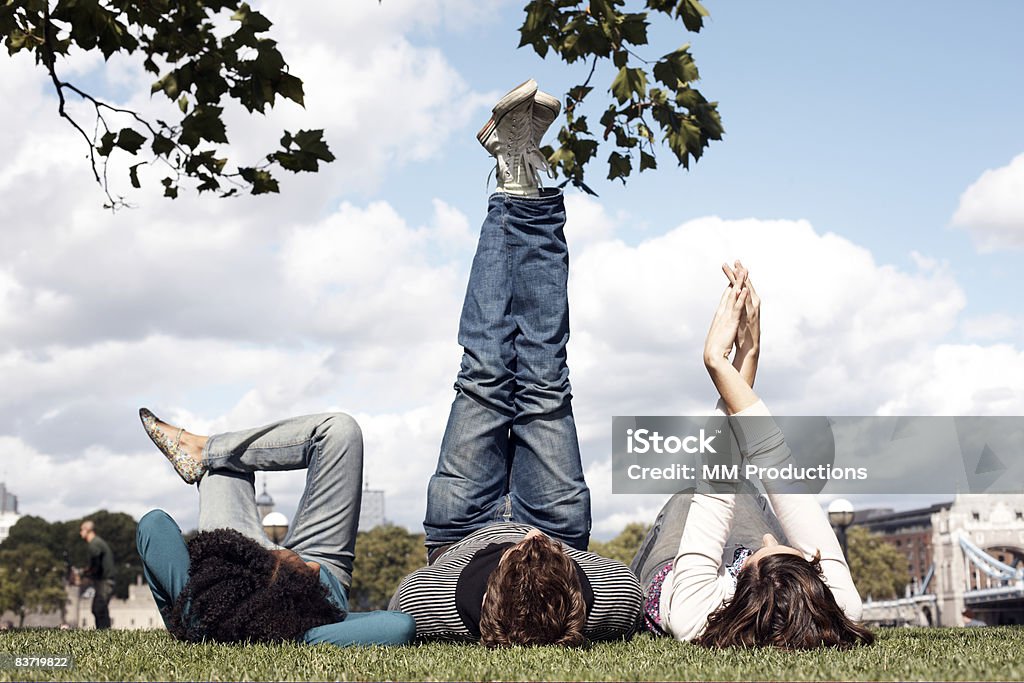 Friends relaxing in park  Public Park Stock Photo