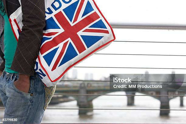 Woman Carrying Union Jack Bag Stock Photo - Download Image Now - 20-24 Years, Adults Only, African Ethnicity