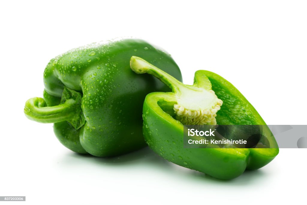 Green bell peppers Green bell peppers with water droplets on white background Green Bell Pepper Stock Photo