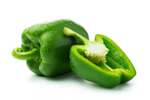 Green bell peppers Green bell peppers with water droplets on white background bell pepper stock pictures, royalty-free photos & images