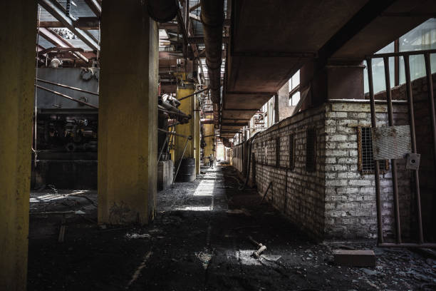 istock Dark corridor in abandoned factory workshop 837208994