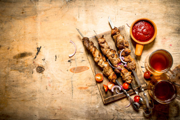 istock Beer with pork Shish kebab and tomatoes. 837209352