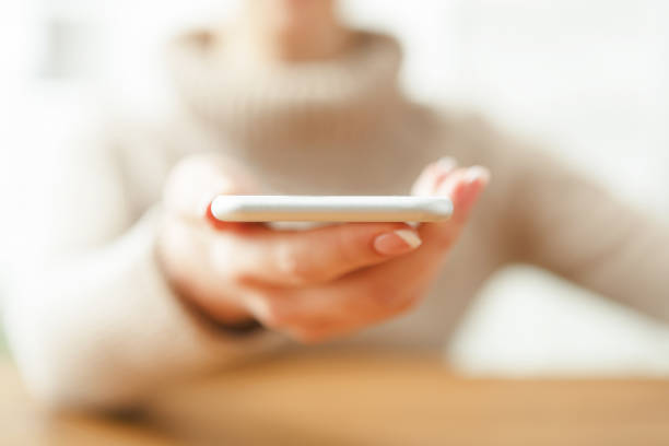 istock Woman holding smartphone, close up, selective focus 837219246